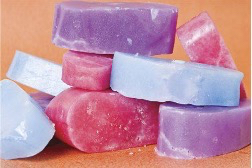 Colorful premium paraffin wax bars used in spa pedicure treatments at Rubi Nail Spa